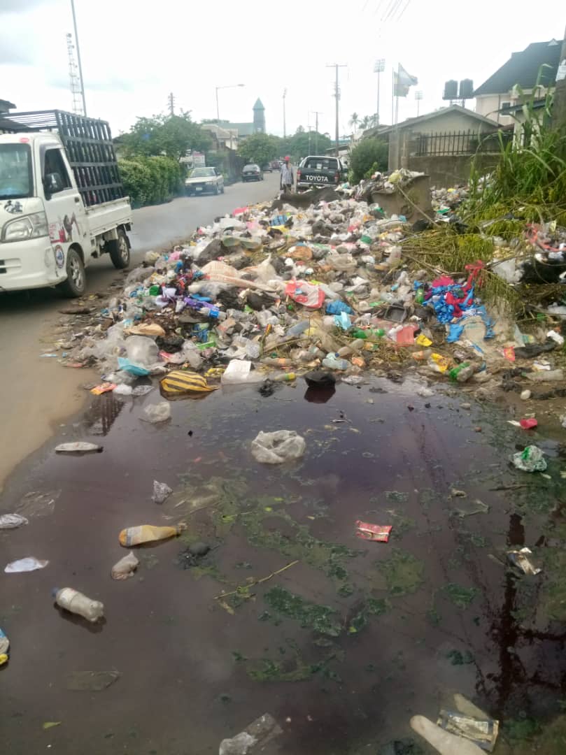 Archival Calabar waste collection point with dark liquid